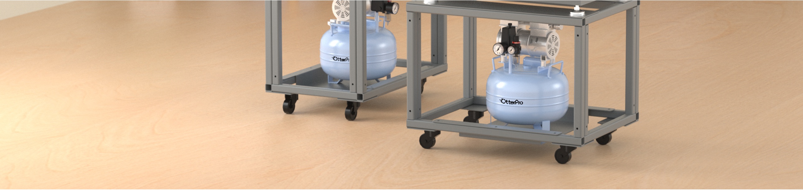 Two compact OtterPro air compressor tanks mounted under the mug press frames on a beige surface