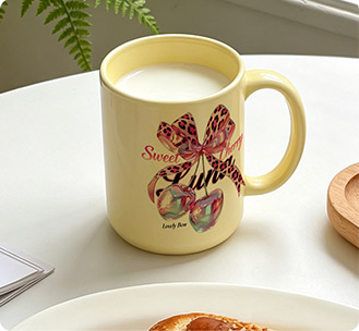 Yellow ceramic mug with decorative bow design for home gift printing